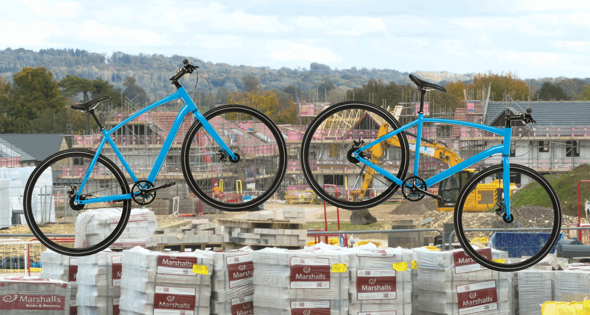 Two bikes layed over a housing development building site