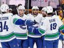 Evander Kane, centre, celebrates his goal with teammates Linus Karlsson (94), Max Sasson, second from left, defenceman Filip Hronek, second from right, and Arshdeep Bains (13) during the first period on Monday in Nashville, Tenn.