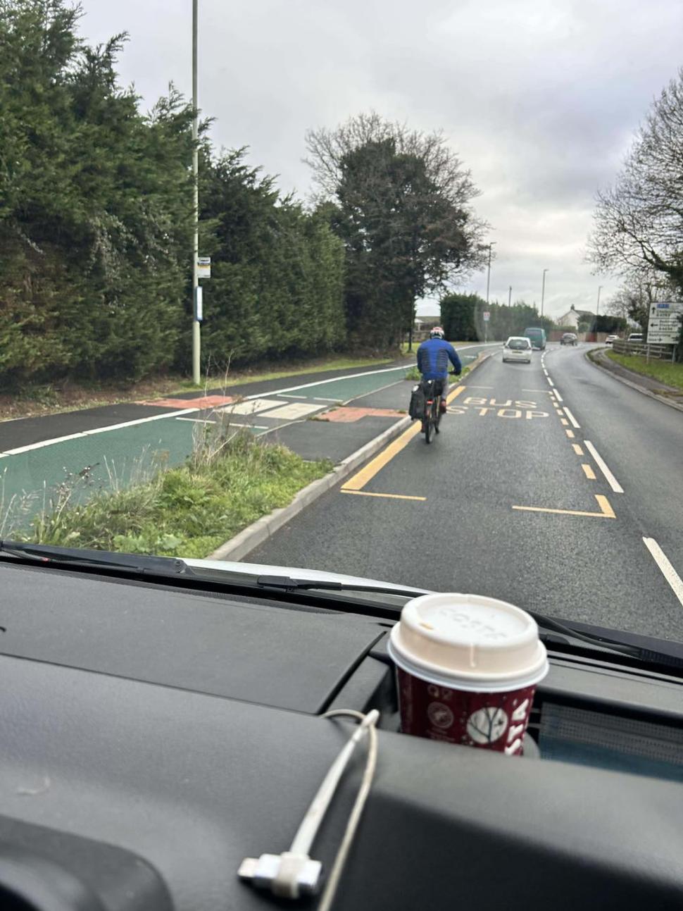 Driver takes photo of cyclist not using adjacent cycle lane, Staverton Driver takes photo of cyclist not using adjacent cycle lane, Staverton