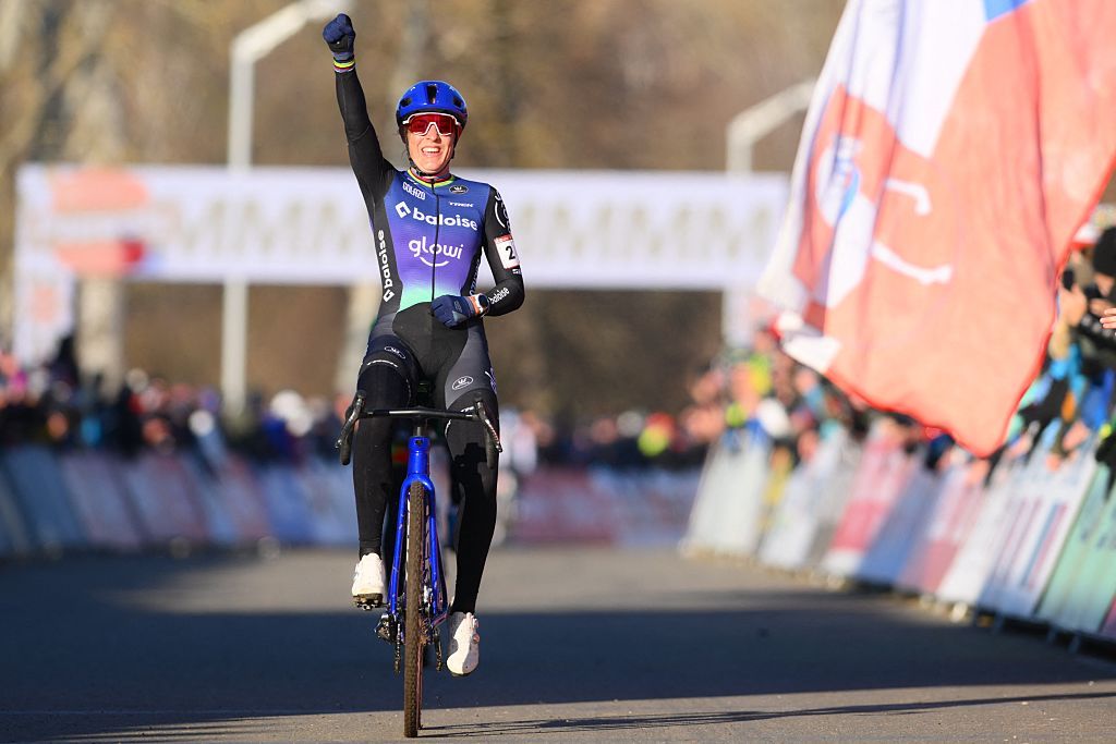 Dutch Lucinda Brand celebrates as she crosses the finish line to win the women elite race at the World Cup cyclocross cycling event in Tabor, Czech Republic, stage 1 (out of 12) of the UCI World Cup cyclocross competition, Sunday 23 November 2025.BELGA PHOTO DAVID PINTENS (Photo by DAVID PINTENS / BELGA MAG / Belga / AFP via Getty Images)
