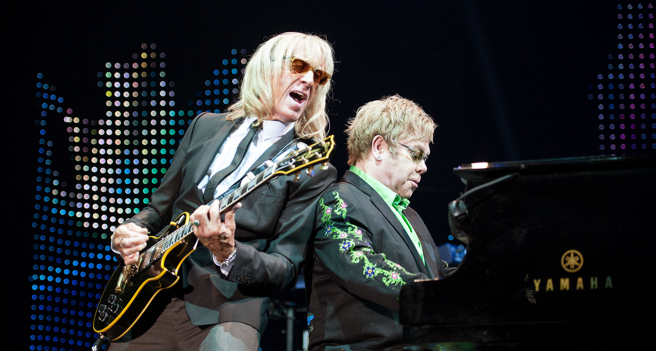 Davey Johnstone and Elton John perform live in Germany, 2012, with Johnstone playing the Gibson Les Paul Custom that John gifted him back in 1972