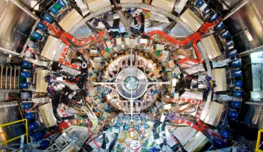 ATLAS detector end-cap being installed inside the Large Hadron Collider. The end-cap extends tracking coverage for particles moving at shallow angles to the beam
