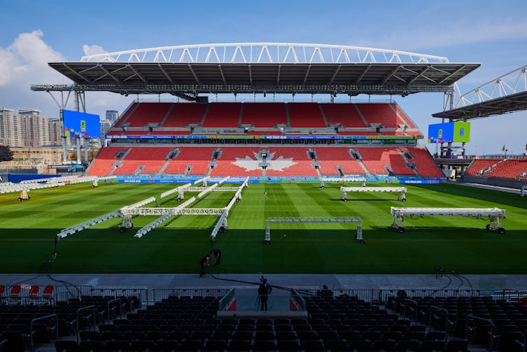 A wide shot of a professional soccer field from the stands