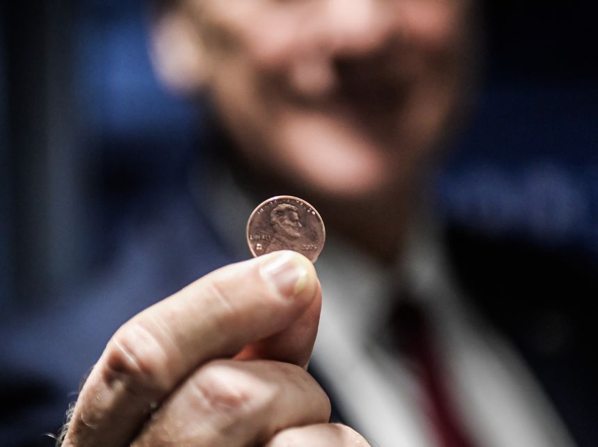 Treasurer of the United States Brandon Beach holds the last penny stamped at the US Mint on November 12 in Philadelphia.