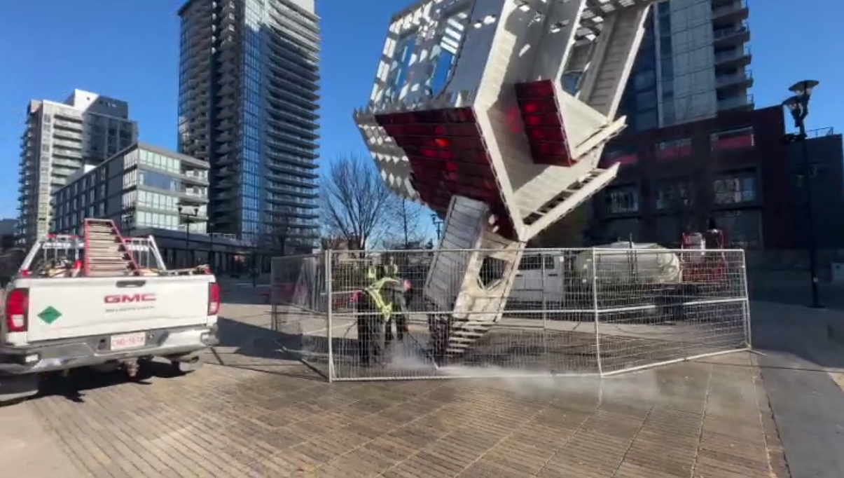 Calgary's upside-down church sculpture vandalized, burned