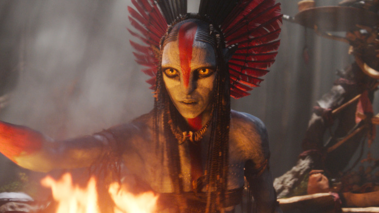 Oona Chaplin as Varang standing over an open fire in Avatar: Fire and Ash
