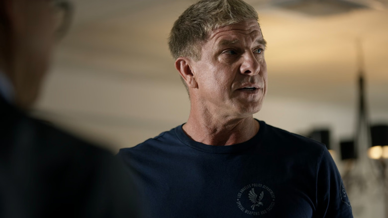 Dominique Luca (Kenny Johnson) in a living room on S.W.A.T.