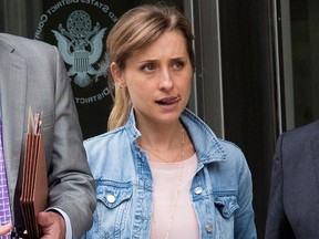 SOCIAL WORKER? Actress Allison Mack leaves Federal court, Wednesday, July 25, 2018, in the Brooklyn borough of New York City.