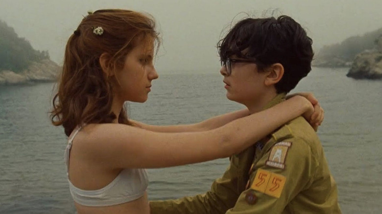 Sam (Jared Gilman) and Suzy (Kara Hayward) dance in front of a lake in Moonrise Kingdom