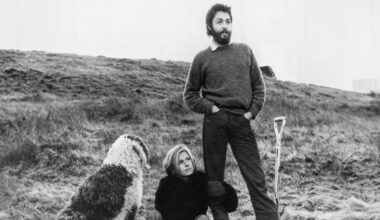 Paul and Linda McCartney, plus dog, on their farm, black and white photo