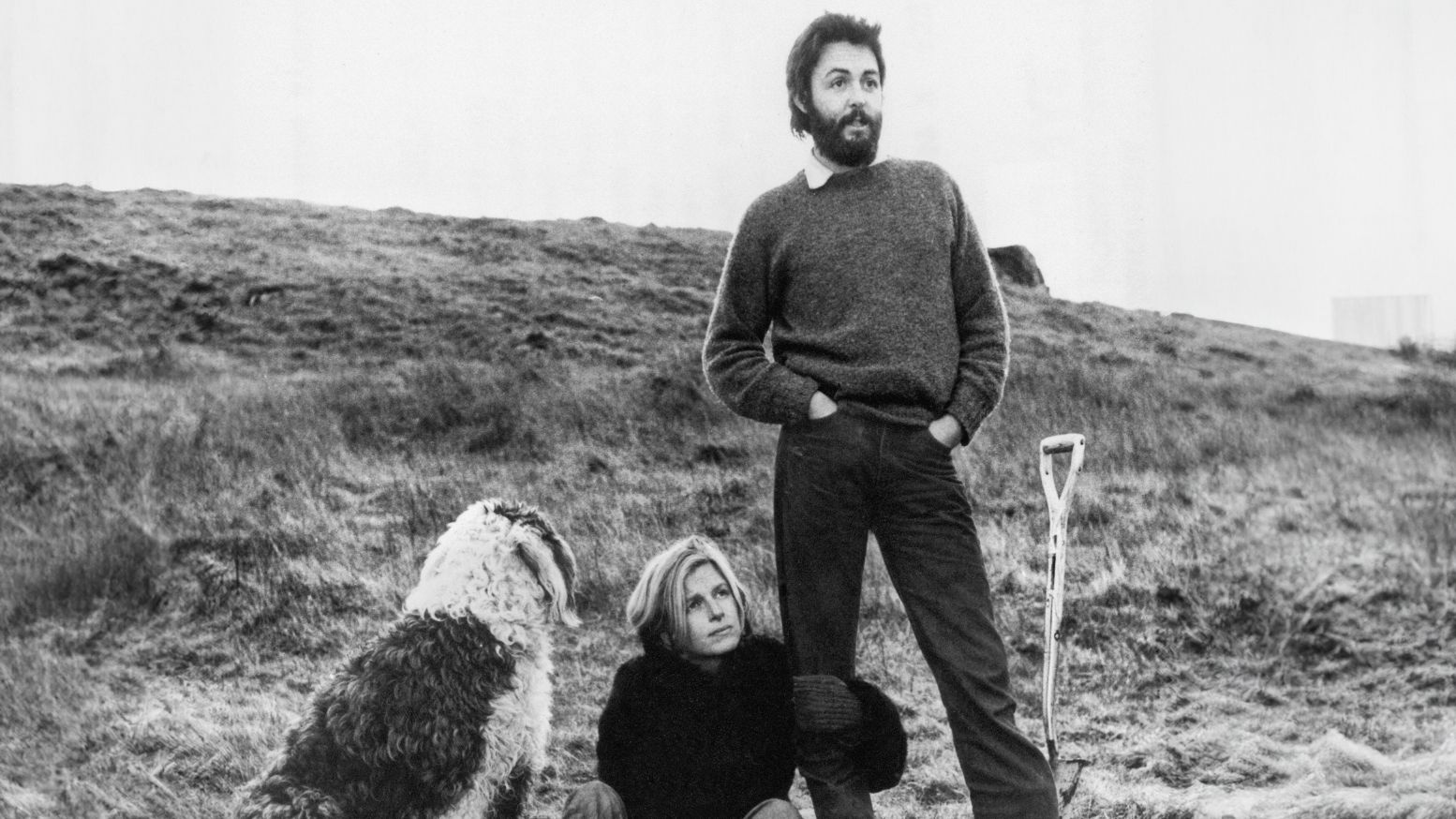 Paul and Linda McCartney, plus dog, on their farm, black and white photo
