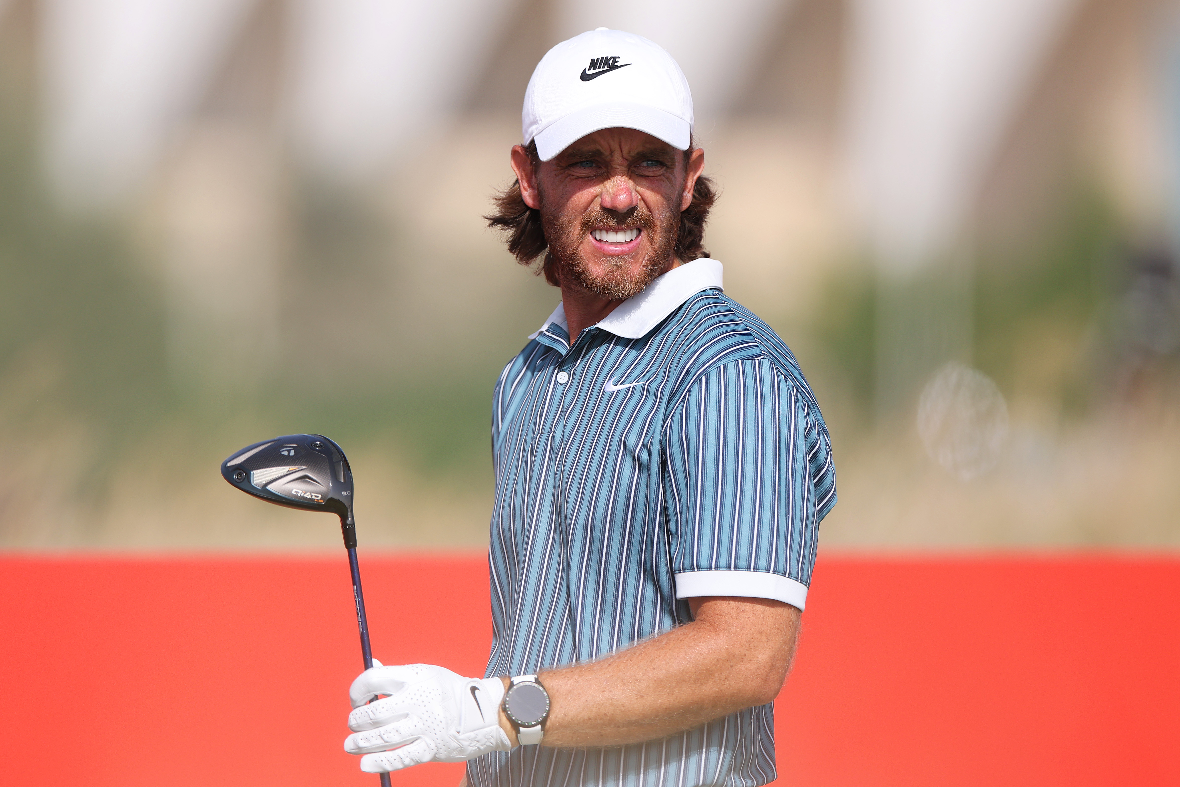 Tommy Fleetwood watches his tee shot