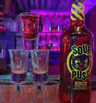 Phillips Distilling Company has signed a five-year deal to shift Sour Puss production to Quebec after several provinces pulled U.S.-made alcohol from their shelves amid the trade dispute.