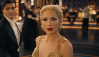 Jennifer Lopez with platinum blonde hair in yellow dress in Kiss of the Spider Woman