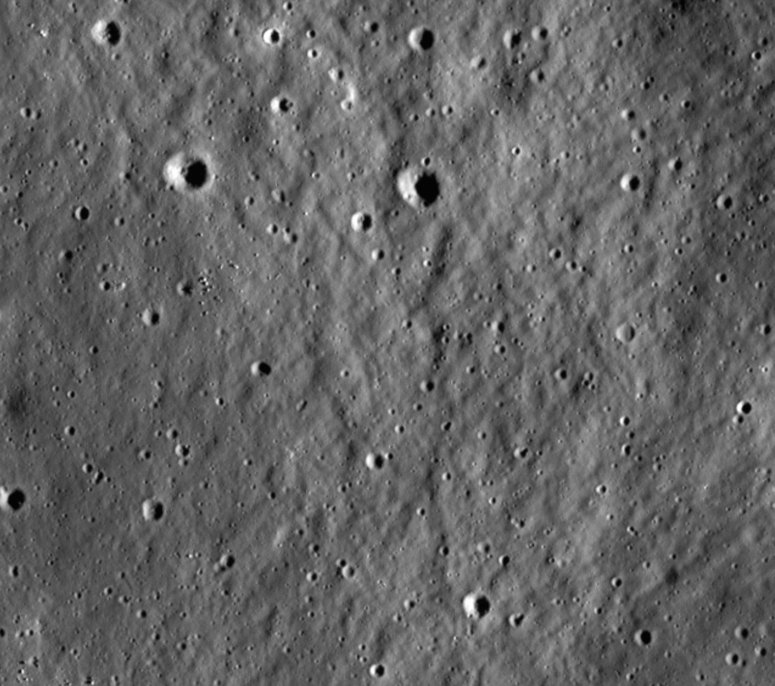 A gif showing a white crater appearing on the gray surface of the moon