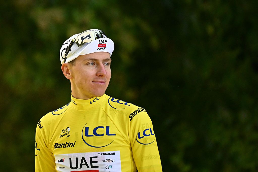 UAE Team Emirates - XRG team's Slovenian rider Tadej Pogacar celebrates on the podium with the overall leader's yellow jersey after the 21st and final stage of the 112th edition of the Tour de France cycling race, 132.3 km between Mantes-la-Ville and Paris Champs-&Eacute;lysees, on July 27, 2025. (Photo by Loic VENANCE / AFP)
