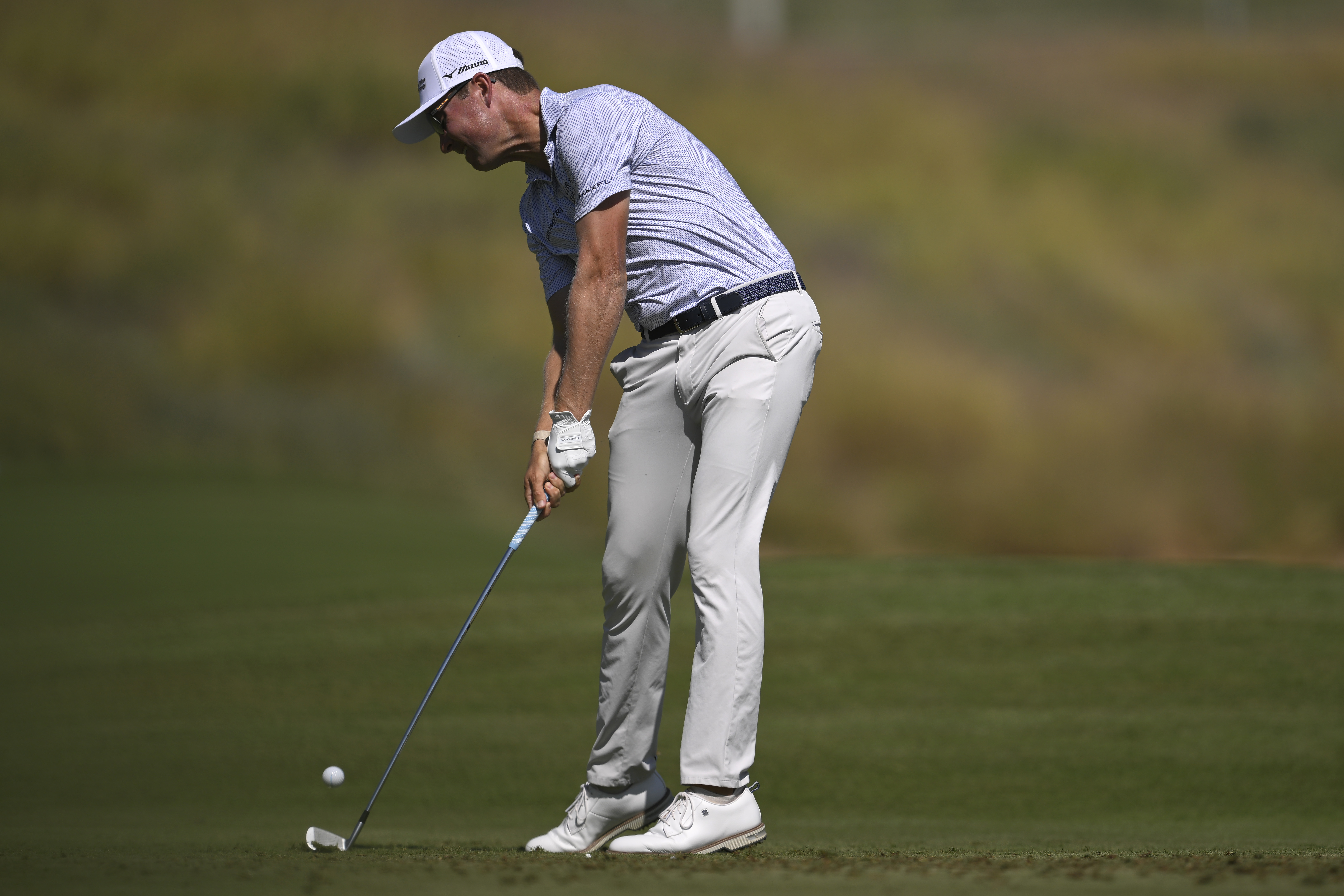 Ben Griffin hits an iron shot from the fairway