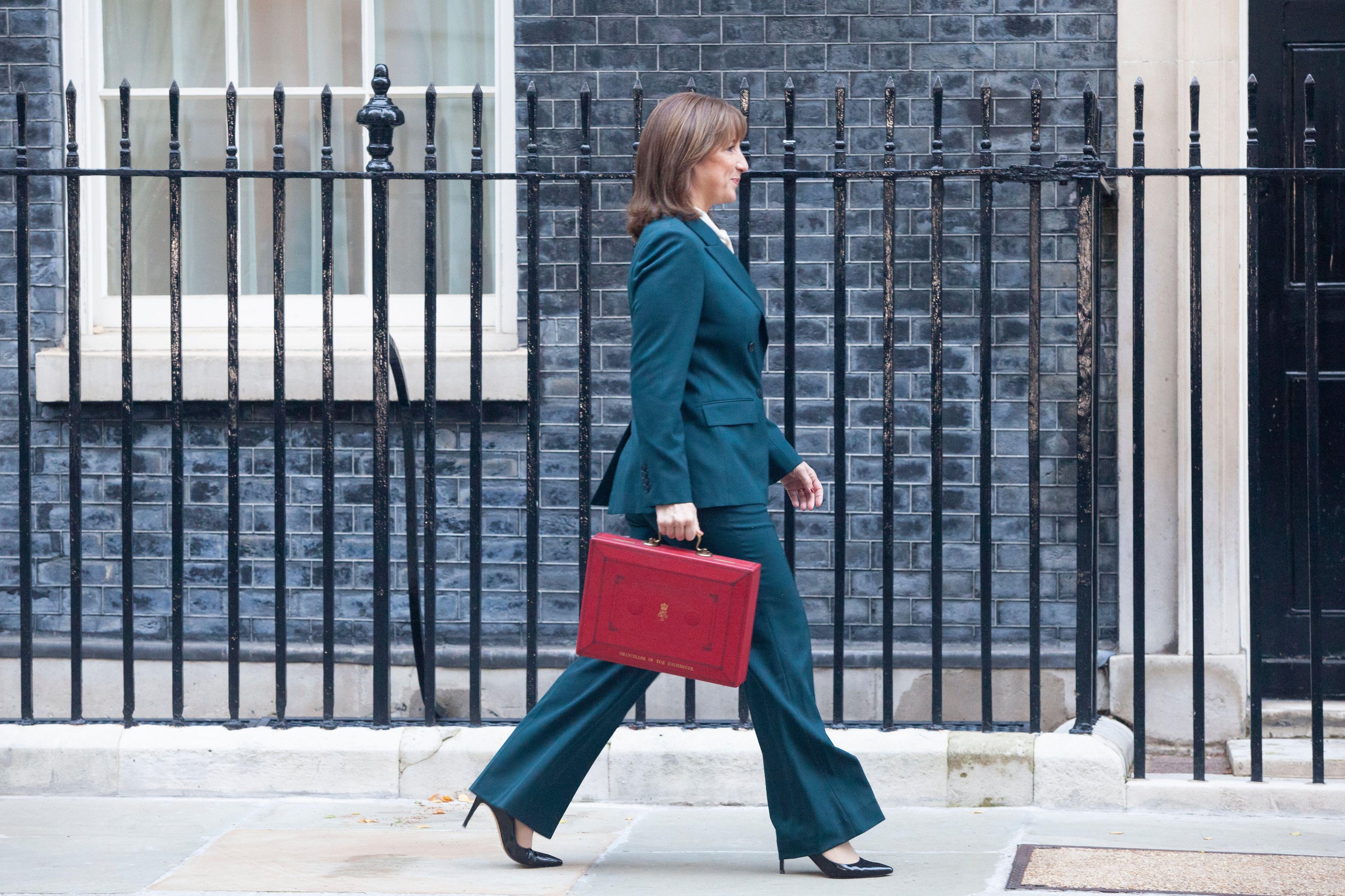 Rachel Reeves carrying a red despatch box at Downing Street.