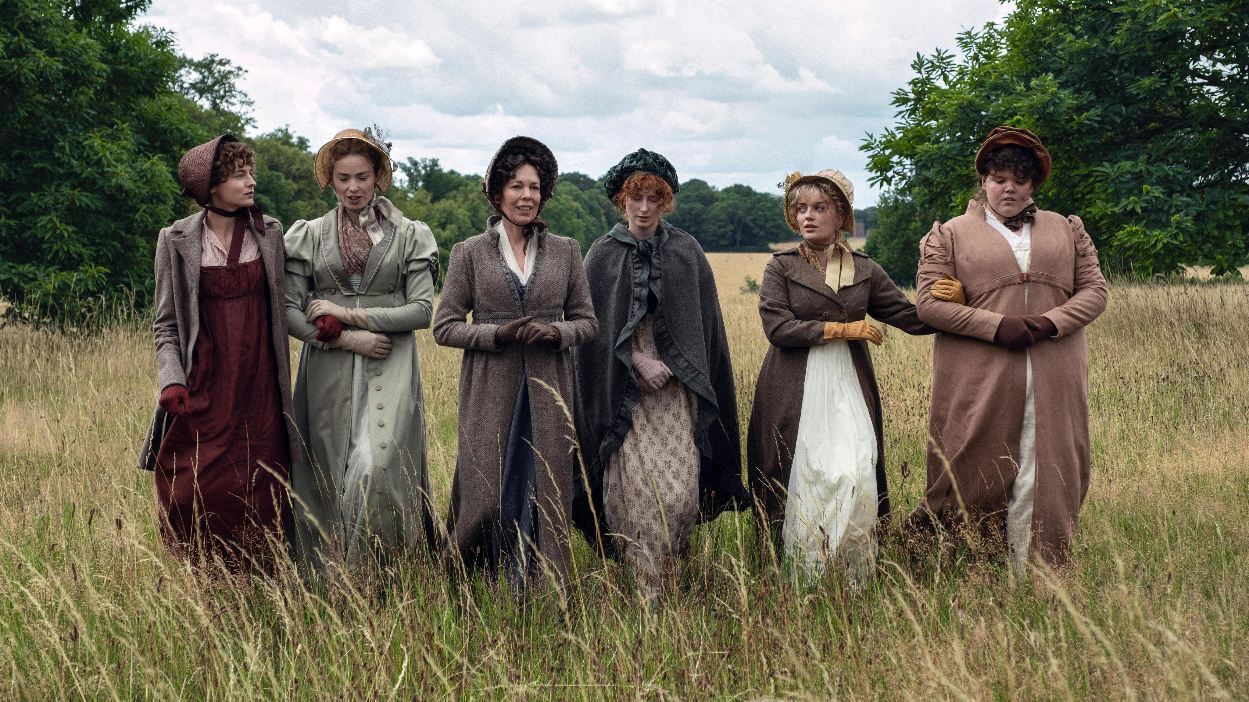 Emma Corrin, Freya Mavor, Olivia Colman, Hopey Parish, Rhea Norwood, and Hollie Avery as the Bennet women.