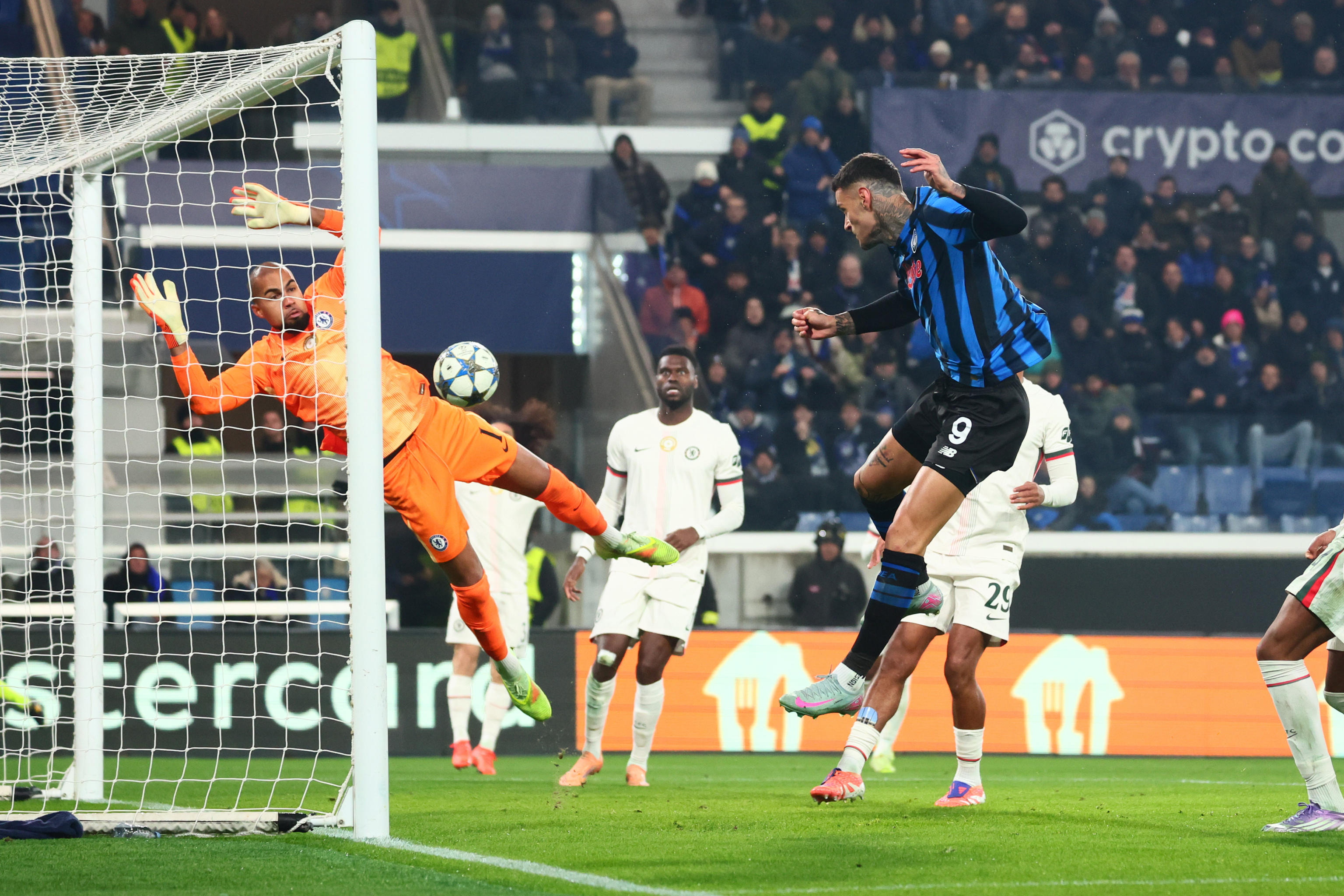 Atalanta's Gianluca Scamacca scoring a goal against Chelsea FC during a UEFA Champions League soccer match.