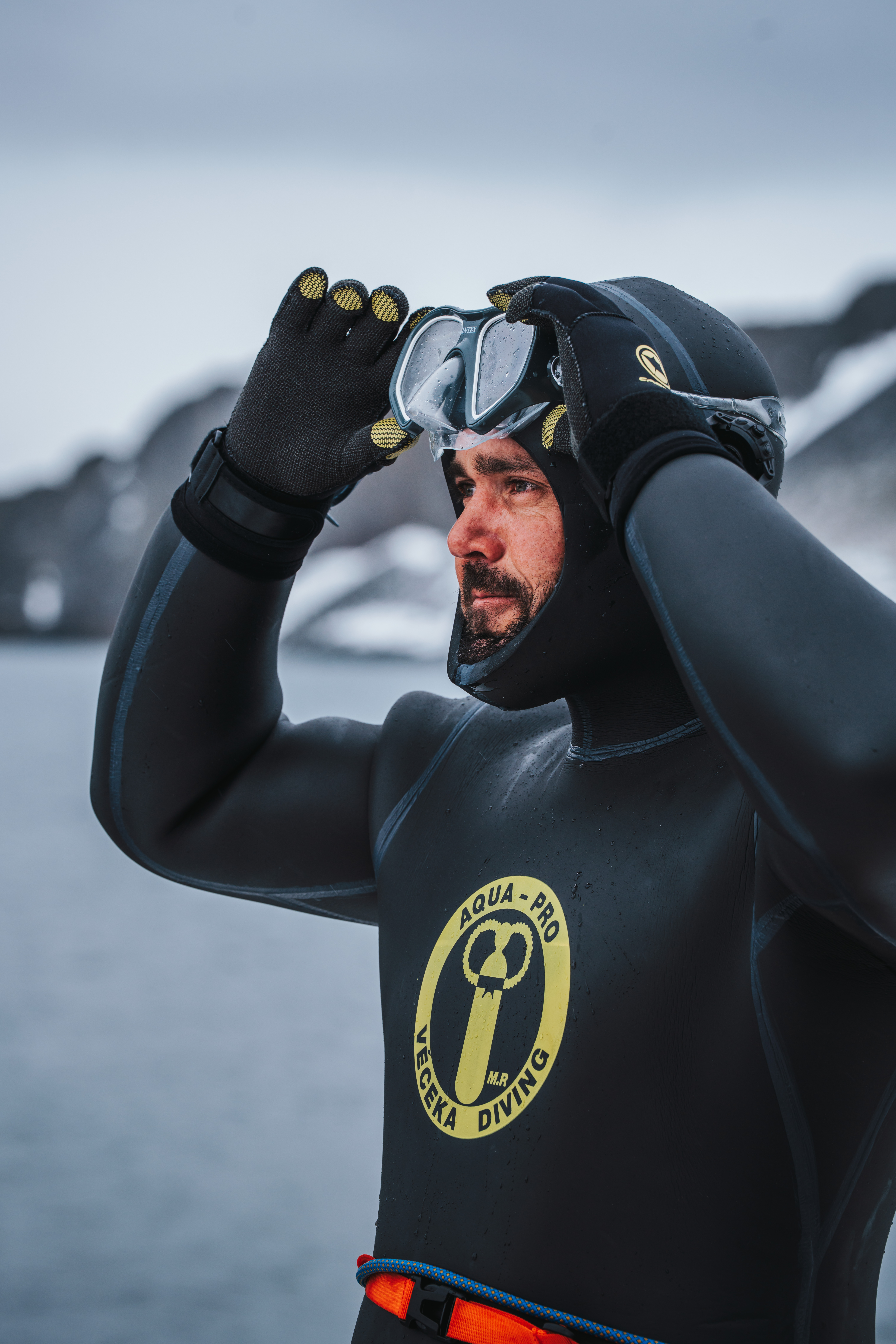 Spencer Matthews adjusting his diving mask in the Antarctic.