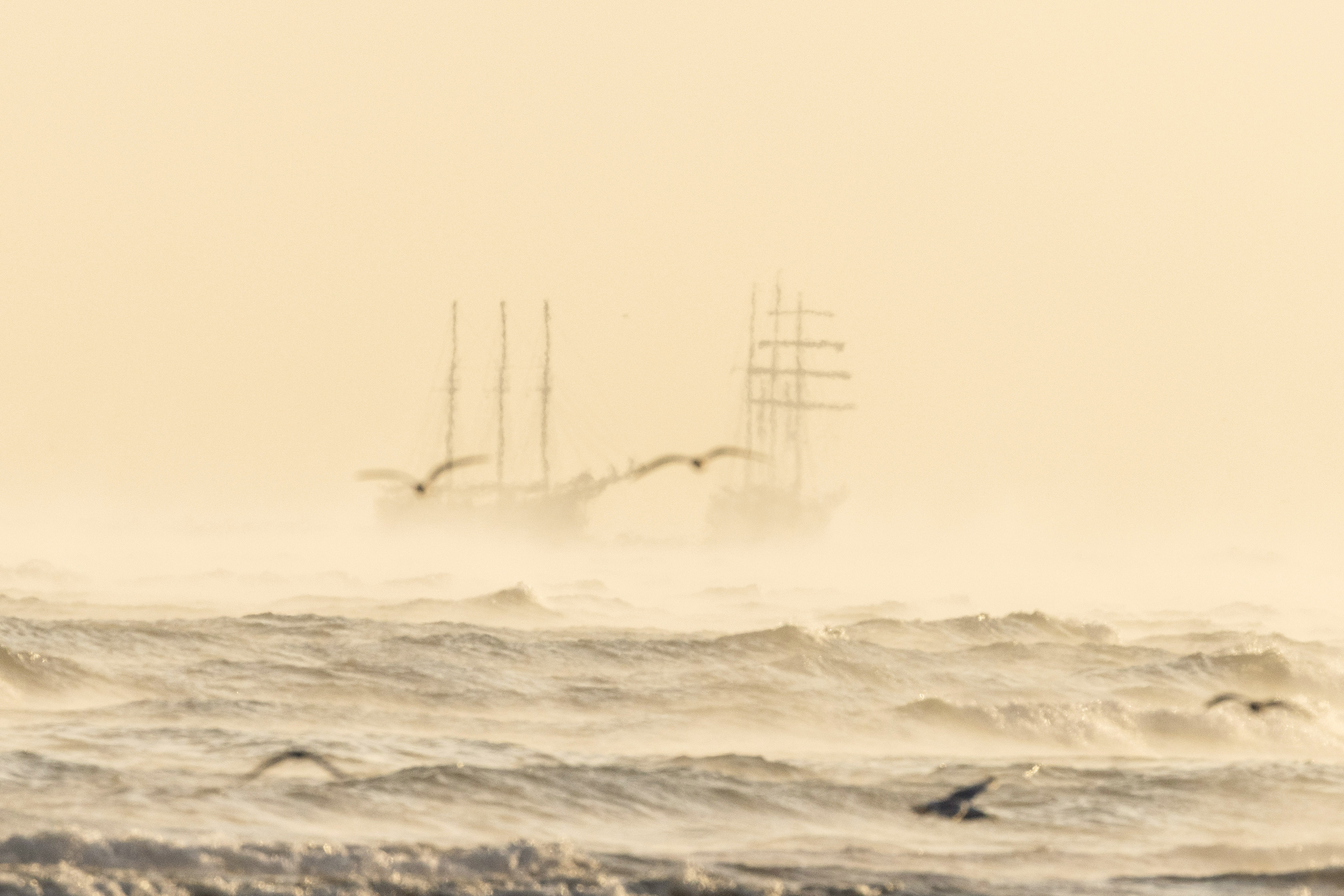 Tall ships in the mist off the coast of Gravelines, France.