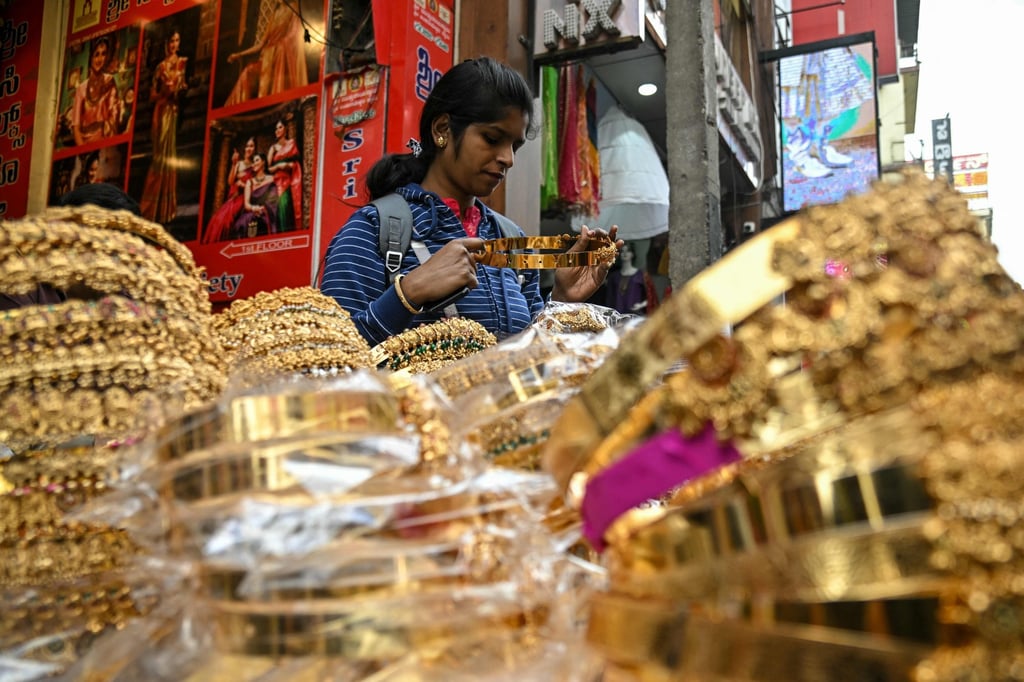 A woman shops for artificial jewellery at a roadside stall in Bengaluru in December. Photo: AFP