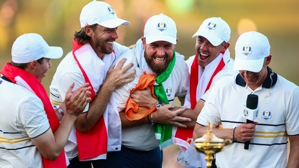 Europe players, from left, Tommy Fleetwood, Shane Lowry and Rory McIlroy celebrates with the Ryder Cup