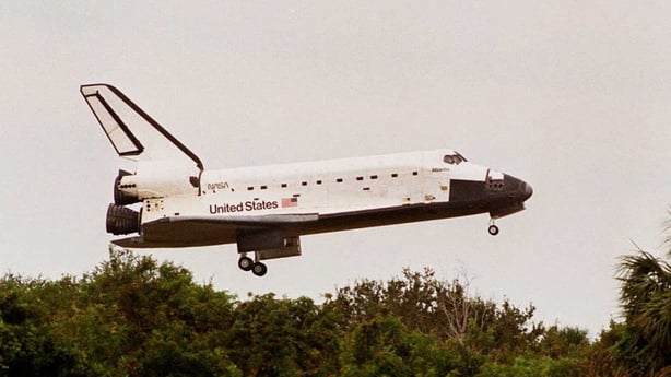 The Space Shuttle Atlantis approaches the runway 20 November at Kennedy Space Center in Florida