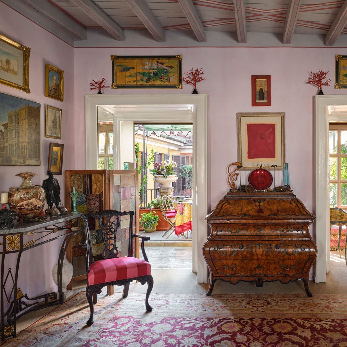Interior of a vintage-style living space with antique furniture and decorative elements.