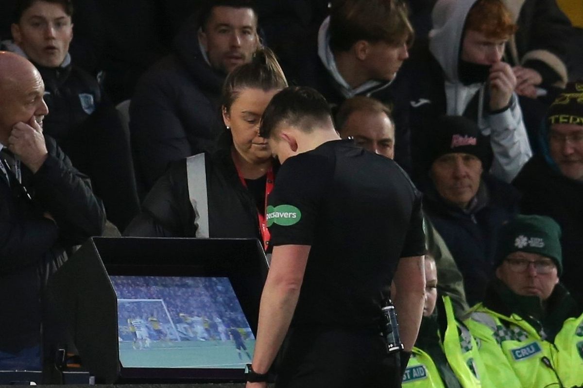 Matthew MacDermid checks the monitor after being called over by Nick Walsh