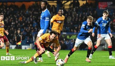 Motherwell's Lukas Fadinger goes down under a challenge from Rangers Emmanuel Fernandez