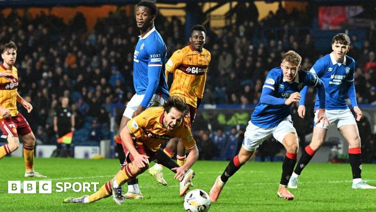 Motherwell's Lukas Fadinger goes down under a challenge from Rangers Emmanuel Fernandez