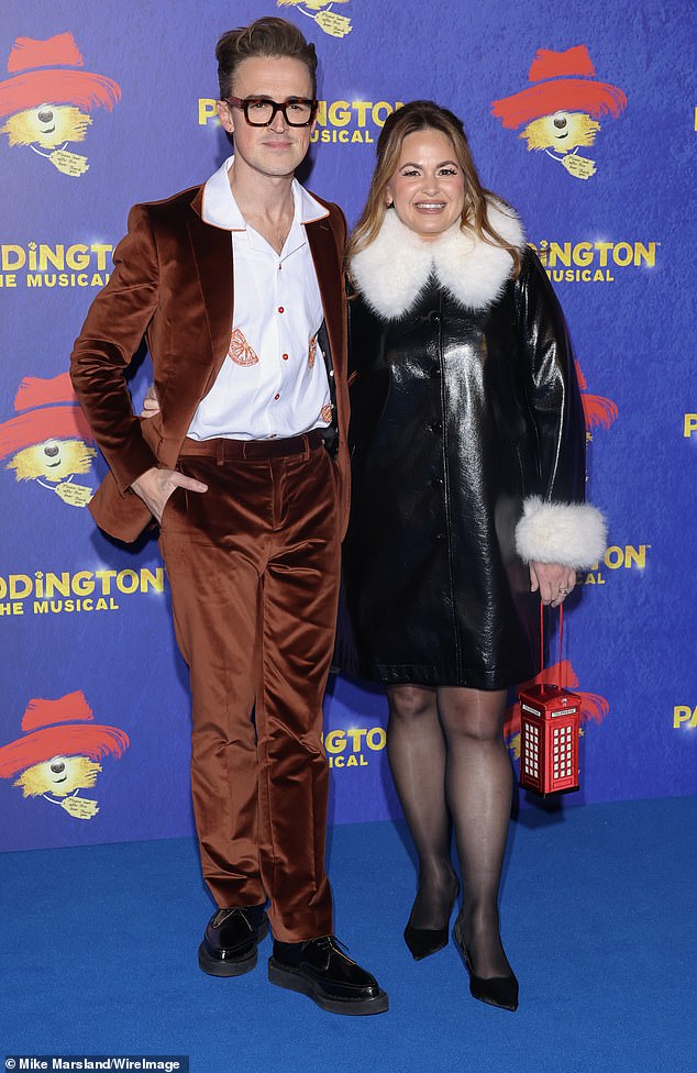 The popstar who was supported by glam wife Giovanna looked stylish in a brown velvet suit and graphic white shirt