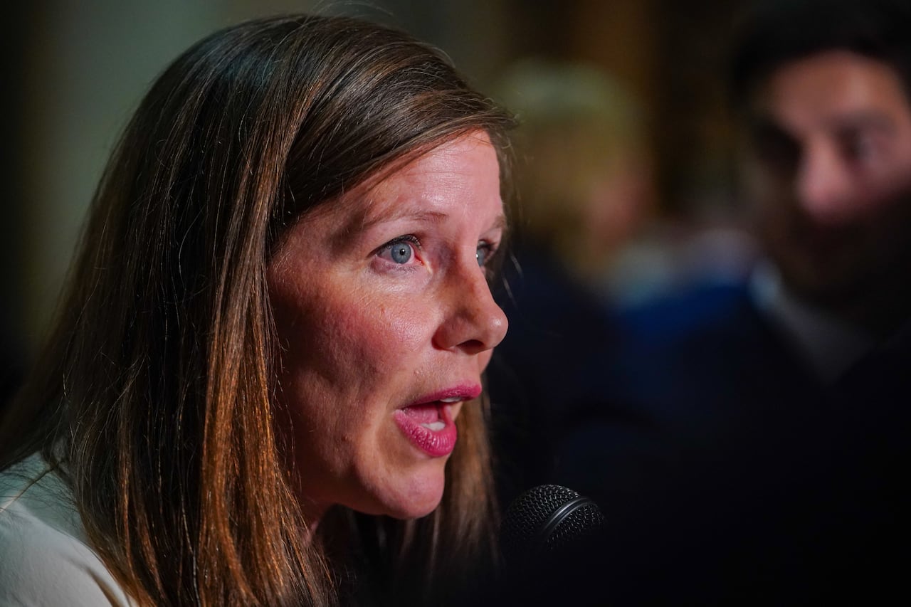 close up of woman in press scrum