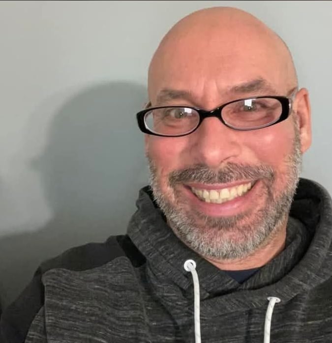 A man poses for a photo