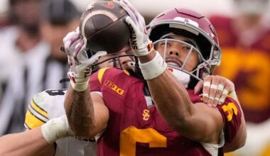 FILE - Southern California wide receiver Makai Lemon, right, makes a catch while under pressure from Iowa defensive back Zach Lutmer during the second half of an NCAA college football game, Saturday, Nov. 15, 2025, in Los Angeles. (AP Photo/Mark J. Terrill, File)