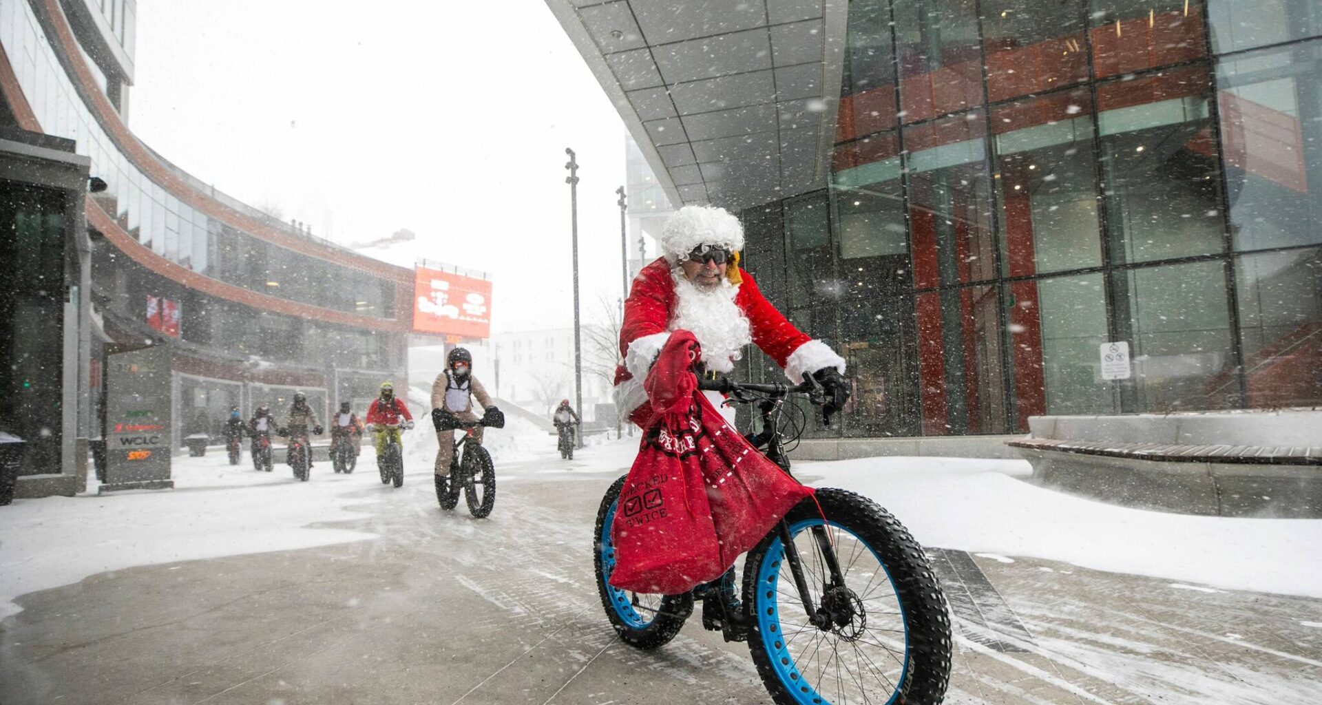 Santa, other cyclists brave nasty weather to spread goodwill, supplies – Winnipeg Free Press