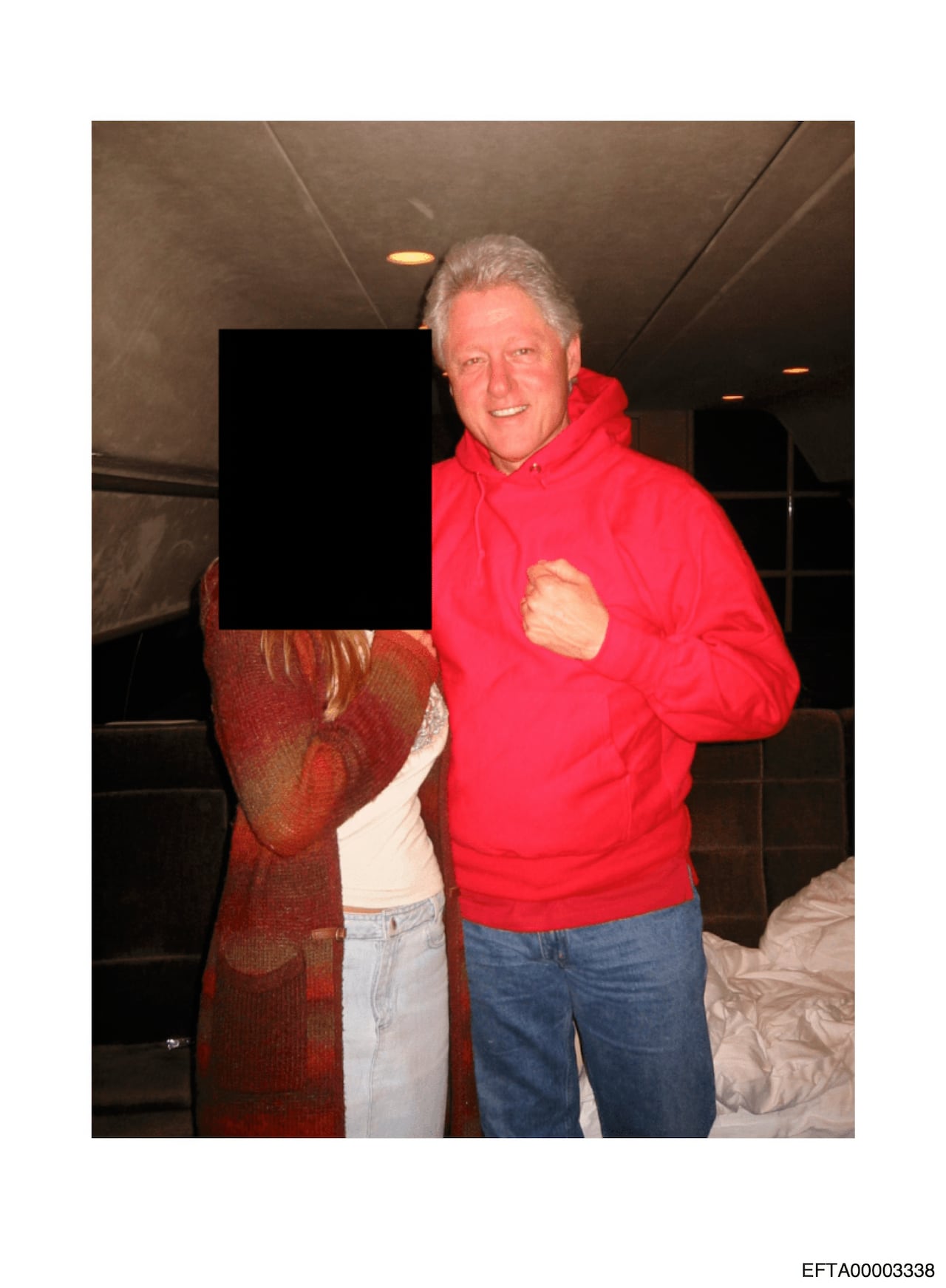 A grey-haired man is pictured with an unidentified person.