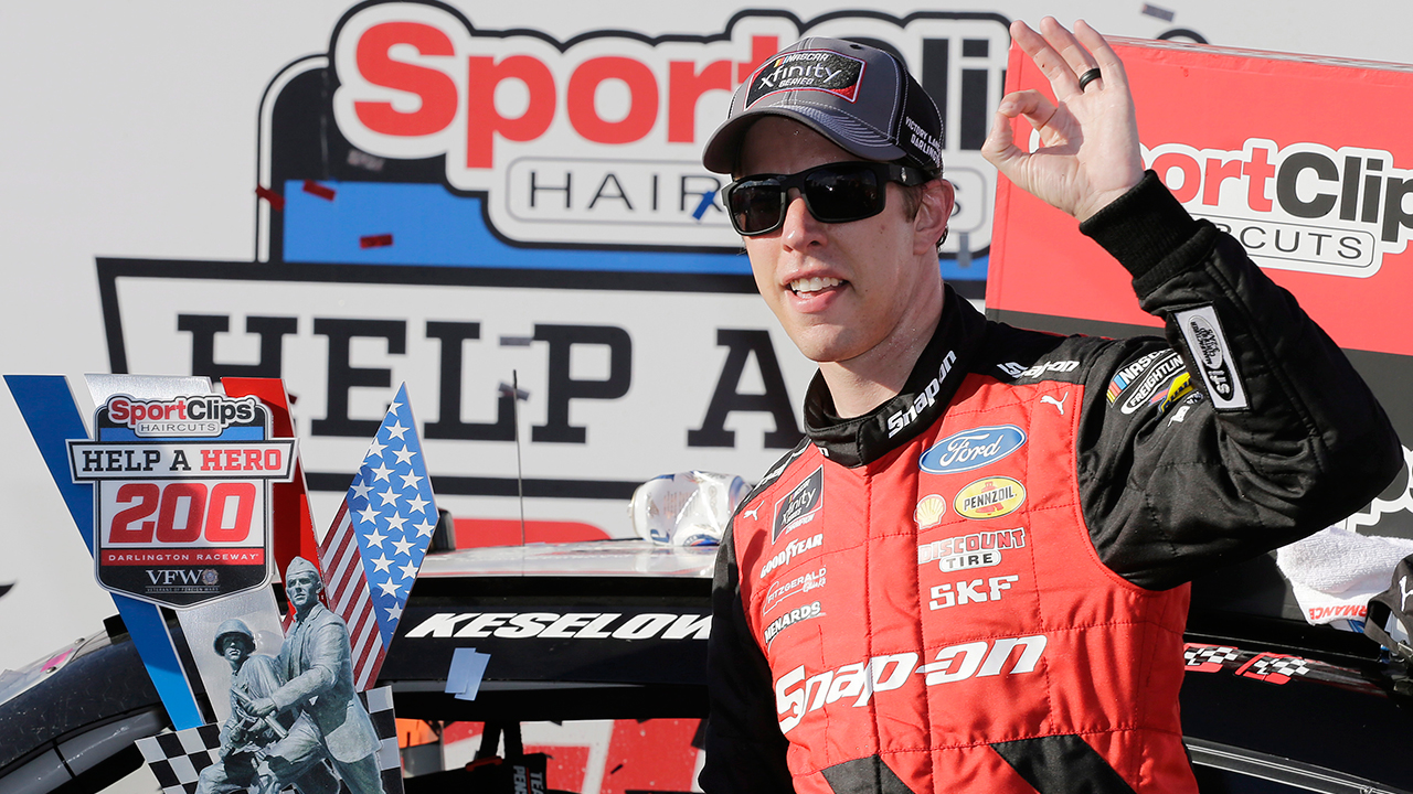 Brad Keselowski stands with his trophy in Victory Lane after winning the NASCAR Xfinity Series auto race at Darlington Raceway, Saturday, Sept. 1, 2018, in Darlington, S.C. (Terry Renna/AP)