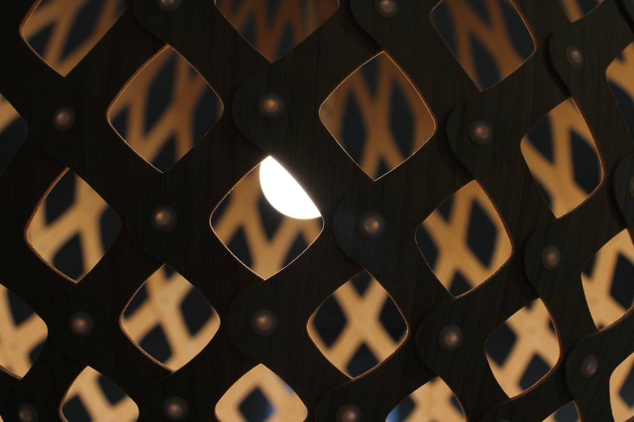 photo of a light shining through a lampshade