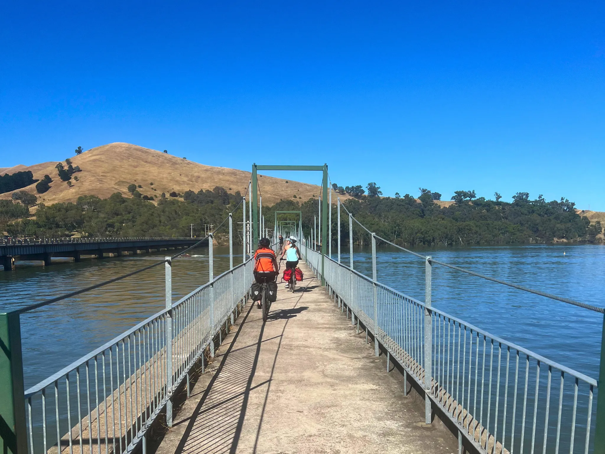 Bikes riding over bridge 