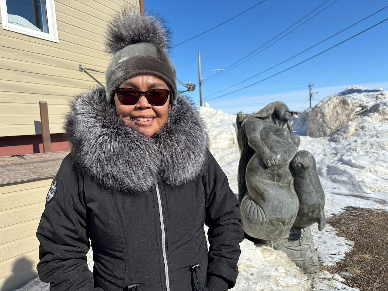 A woman in winter gear, photographed outside.