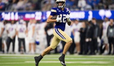Washington wide receiver Denzel Boston (12) runs with the ball for a touchdown during the LA Bowl NCAA college football game against Boise State Saturday, Dec. 13, 2025, in Inglewood, Calif. (AP Photo/Kyusung Gong)