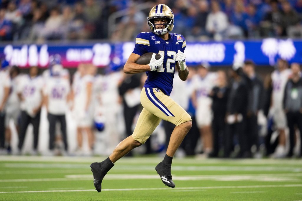 Washington wide receiver Denzel Boston (12) runs with the ball for a touchdown during the LA Bowl NCAA college football game against Boise State Saturday, Dec. 13, 2025, in Inglewood, Calif. (AP Photo/Kyusung Gong)