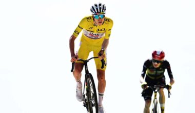 Tadej Pogacar crosses the finish line ahead of Jonas Vingegaard of Denmark and Team Visma