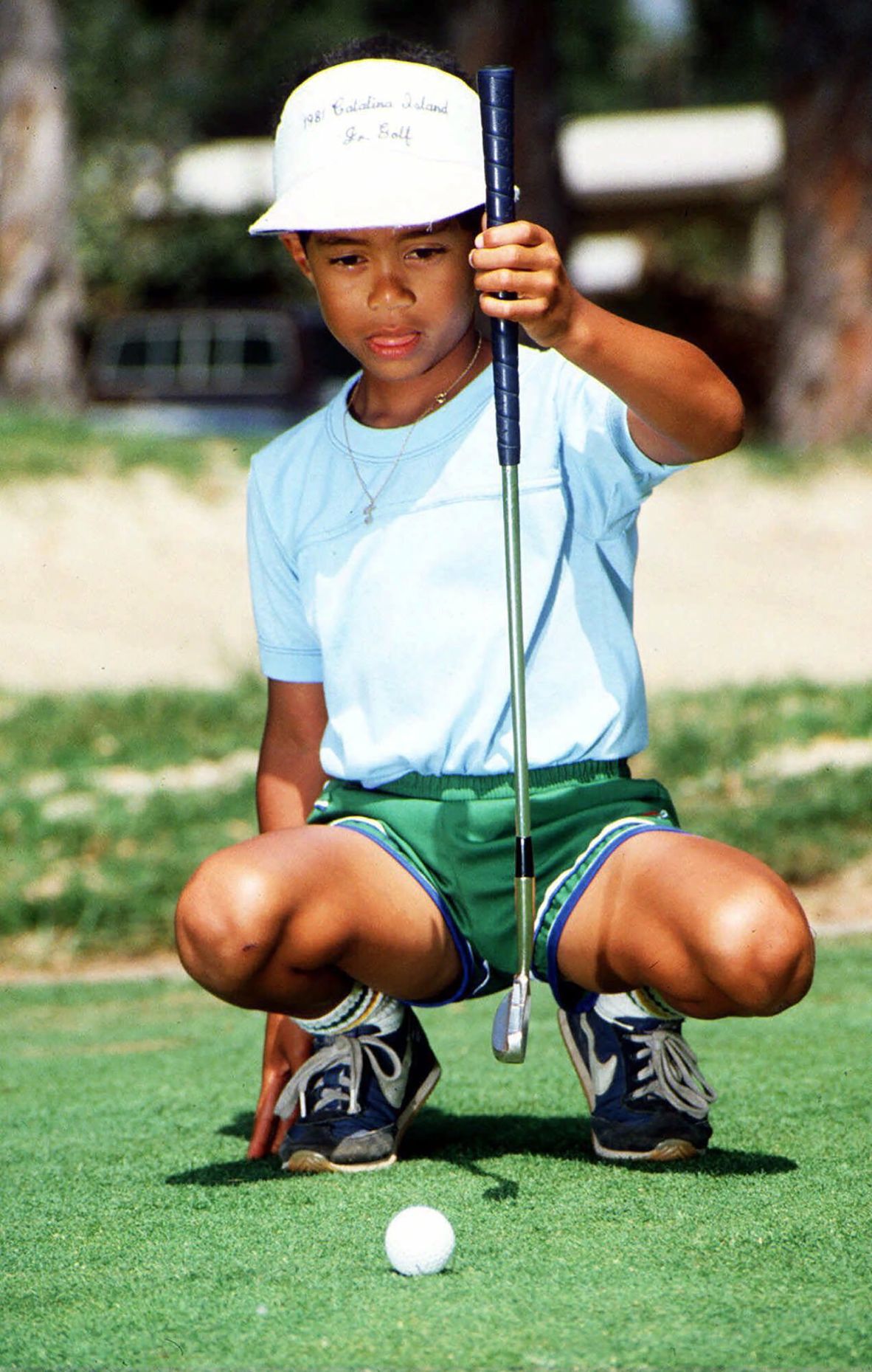 Woods, 6, sizes up a putt in Los Alamitos, California, in 1982. His real name is Eldrick, but his father nicknamed him 