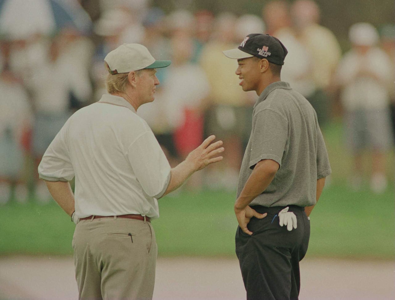Two golfers talk.