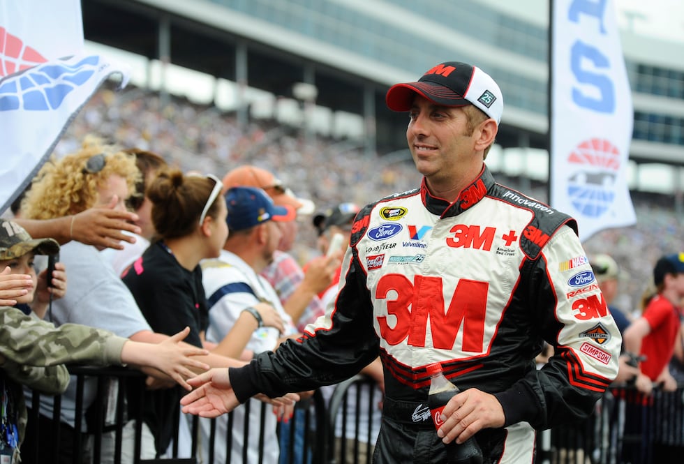 Greg Biffle greets fans before the NASCAR Sprint Cup Series auto race at Texas Motor Speedway...