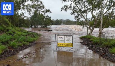 Flooding claims a life as deluge cuts north-west Queensland roads, isolates towns